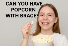 Bowl of popcorn with a braces warning sign, illustrating why popcorn is risky for orthodontic patients